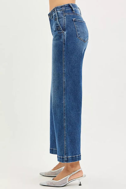 Dark wash RISEN high-rise wide-leg jeans with front pockets and button details, styled by Trendsi.