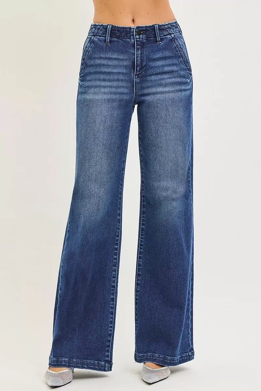 Dark wash RISEN high-rise wide-leg jeans with slanted pockets, styled with a relaxed fit and contemporary design.