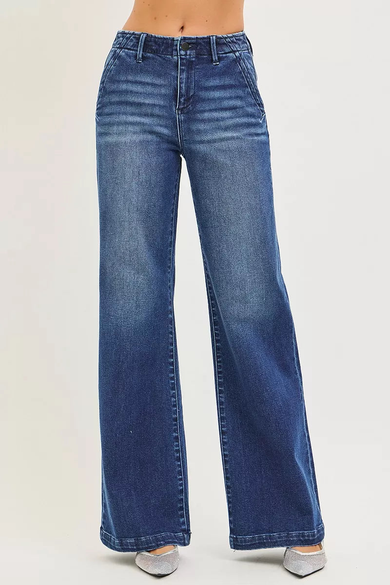 Dark high-rise wide-leg jeans with slanted pockets from RISEN by Trendsi, shown on a model against a neutral background.