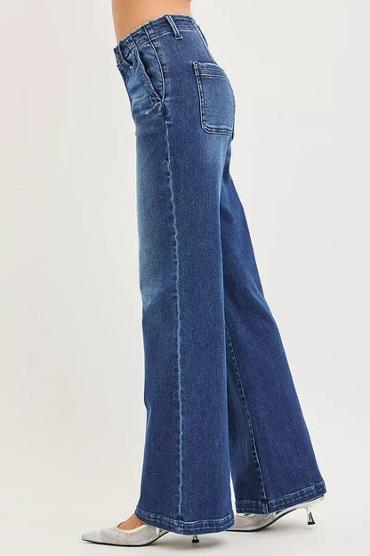Dark high-rise wide-leg jeans with slanted pockets from RISEN by Trendsi, shown on a model.