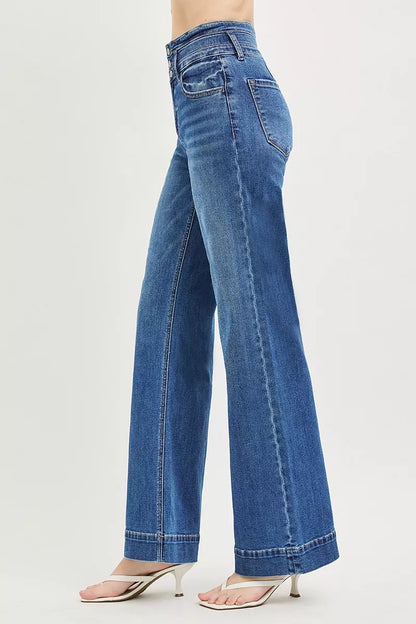 Dark wash RISEN high-rise wide-leg jeans with a wide band detail, styled for a modern, relaxed fit.