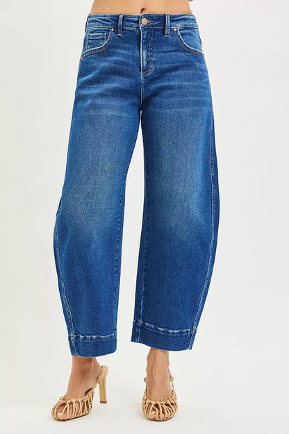 Dark blue Risen mid-rise crop barrel jeans from Trendsi, showing fitted waist, relaxed legs, and stylish cropped length.