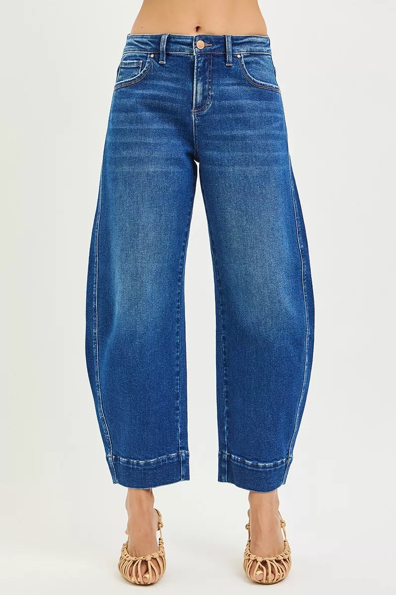 Dark blue RISEN mid-rise crop barrel jeans from Trendsi, showing a fitted waist, cropped length, and wide leg silhouette.