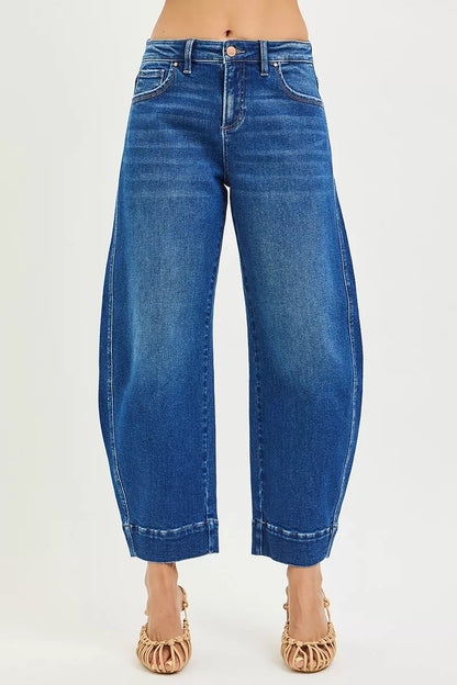 Dark blue RISEN mid-rise crop barrel jeans from Trendsi, showing a fitted waist, cropped length, and wide leg silhouette.