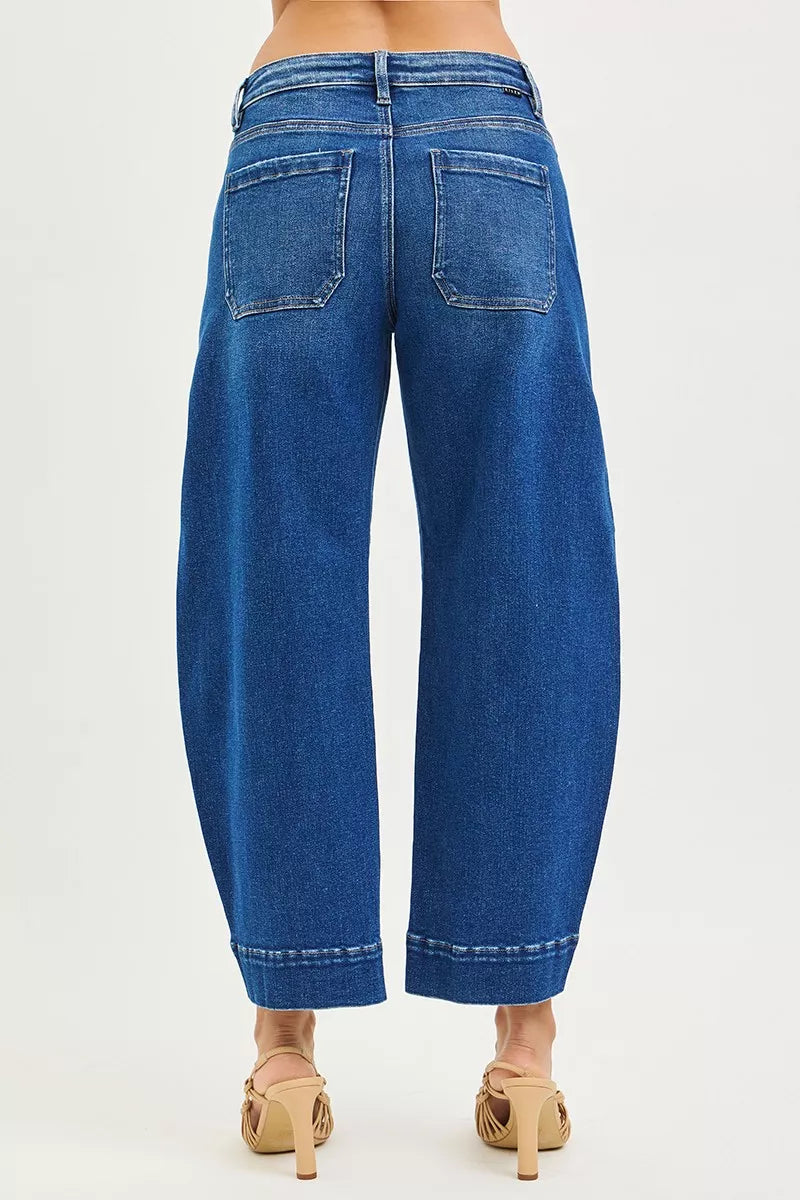 Dark blue RISEN mid-rise crop barrel jeans from Trendsi, shown on a model, featuring a relaxed fit and classic denim style.