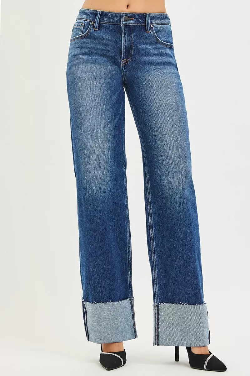 Dark blue RISEN mid-rise wide straight jeans by Trendsi with a wide cuff, showcasing a casual denim look.