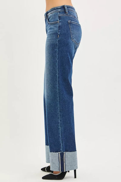 Dark denim RISEN mid-rise wide straight jeans with wide cuff, showing relaxed fit and stylish cuff detail.