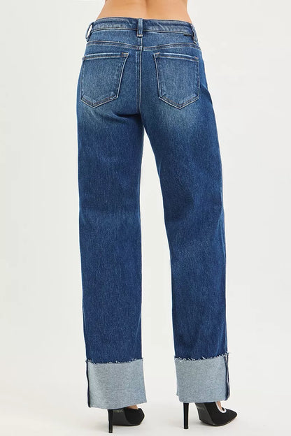 Dark denim RISEN mid-rise wide straight jeans with wide cuff, showcasing relaxed fit and stylish casual design.