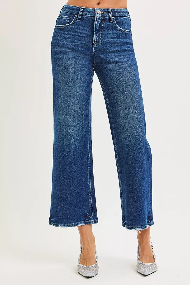 Dark wash RISEN high-rise crop wide-leg jeans by Trendsi with tummy control and 4-way stretch fabric, displayed flat.