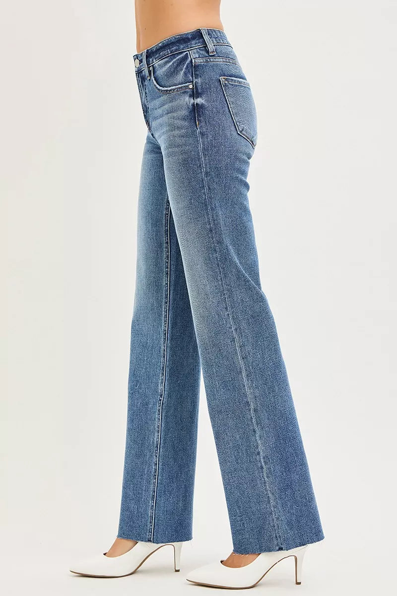 Dark RISEN Tummy Control 4-Way Stretch Mid-Rise Straight Jeans by Trendsi, shown on a model with a close-up of the denim fabric.