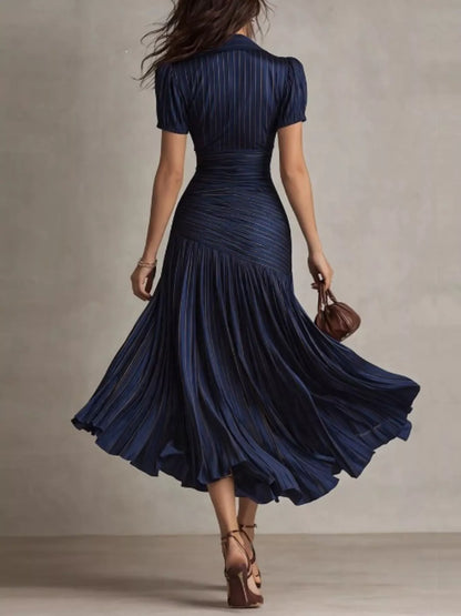 Dark blue pleated striped short sleeve midi dress from Trendsi, featuring a flowy silhouette and stylish pattern.