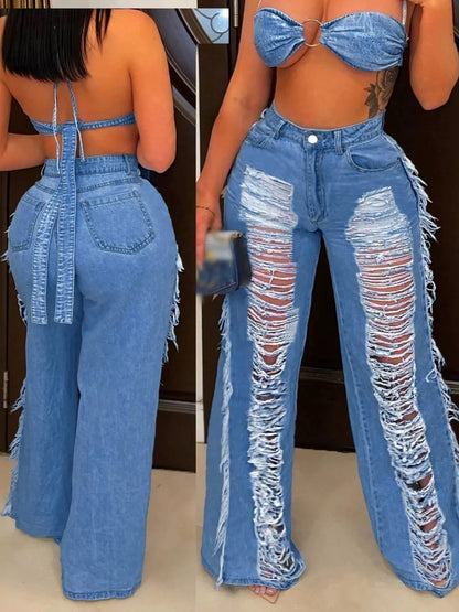 Dark blue distressed wide-leg jeans by Trendsi, featuring a relaxed fit and frayed hem, styled with casual elements.
