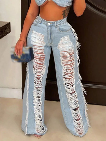 Dark blue distressed wide-leg jeans from Trendsi, featuring a relaxed fit and frayed hem, displayed on a plain background.