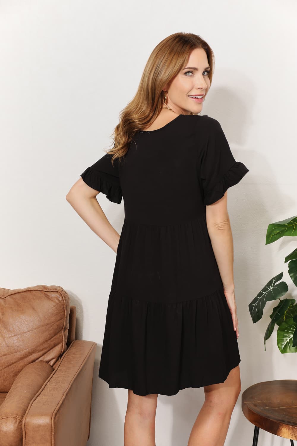 Dark blue Mandy V-Neck Flounce Sleeve Tiered Dress from Trendsi, featuring a v-neckline and layered, flouncy sleeve design.