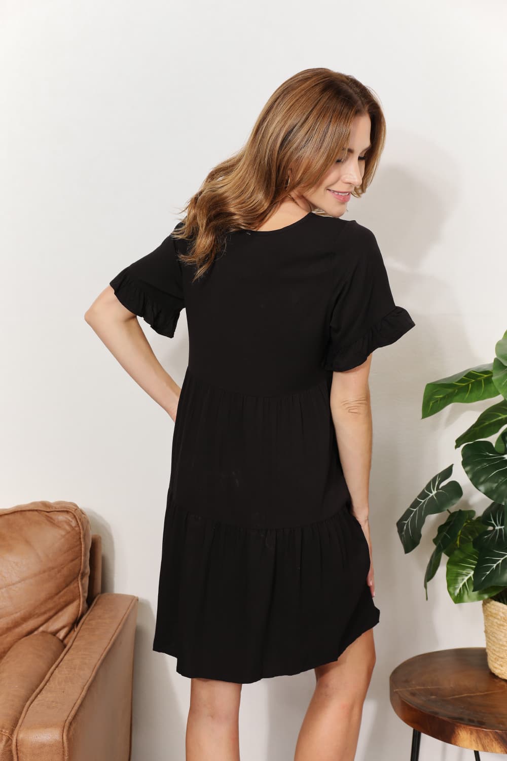 Dark blue Mandy V-Neck Flounce Sleeve Tiered Dress by Trendsi, featuring a V-neck, flounce sleeves, and tiered skirt.