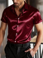 Dark blue men's satin short sleeve shirt by Trendsi, full size, lightweight fabric, relaxed fit, suitable for casual or semi-formal wear.