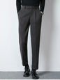 Dark gray men's pleated dress pants by Trendsi, tailored fit with classic pleats and side pockets, suitable for formal occasions.
