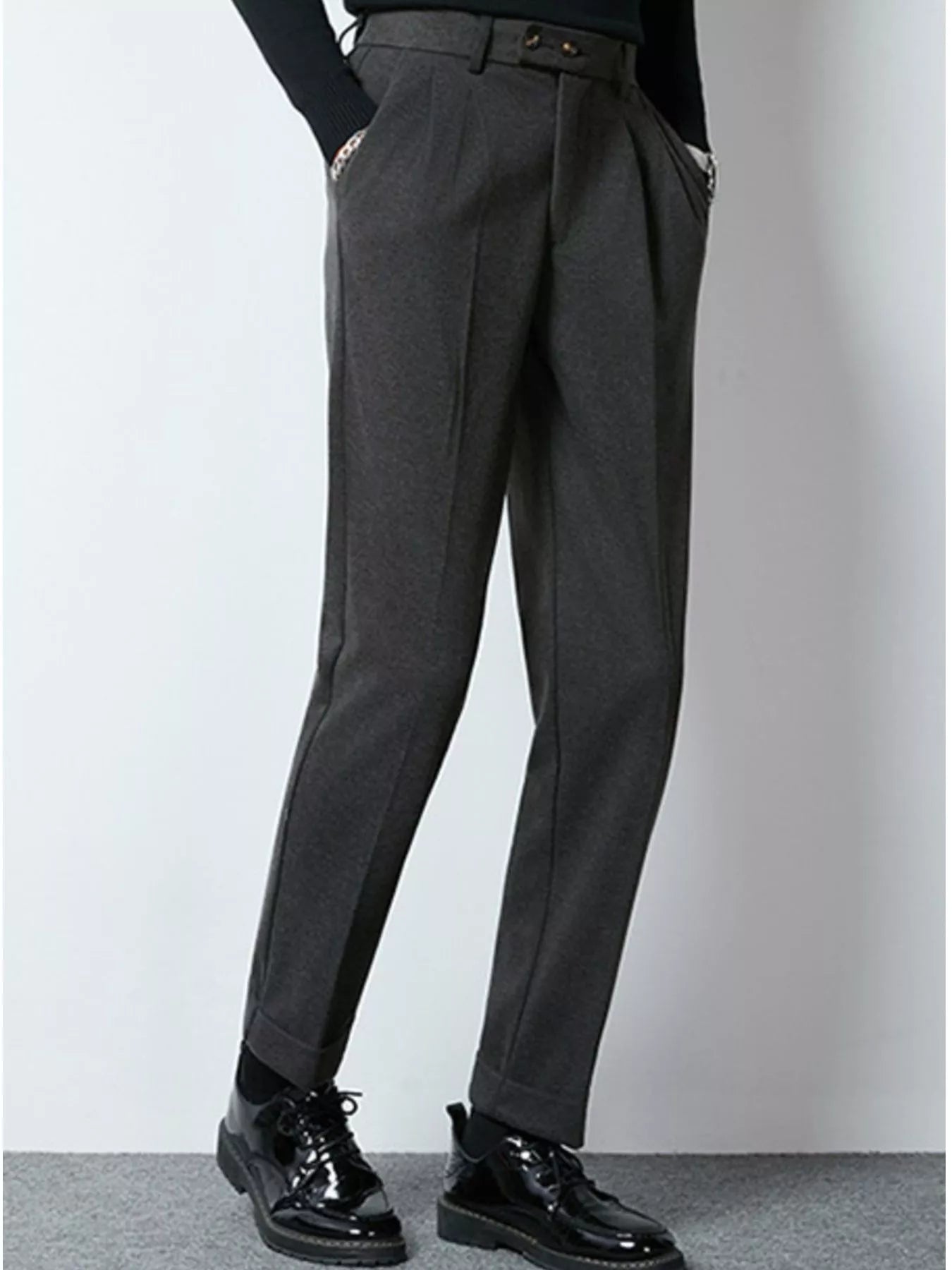Dark gray men's pleated dress pants from Trendsi, tailored fit with front pleats, suitable for formal or professional wear.