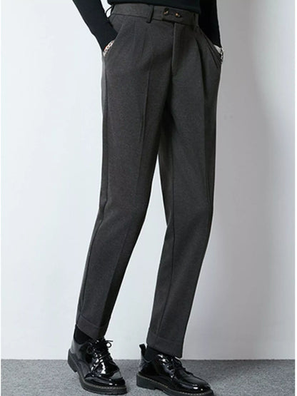 Dark gray men's pleated dress pants from Trendsi, tailored fit with front pleats, suitable for formal or professional wear.
