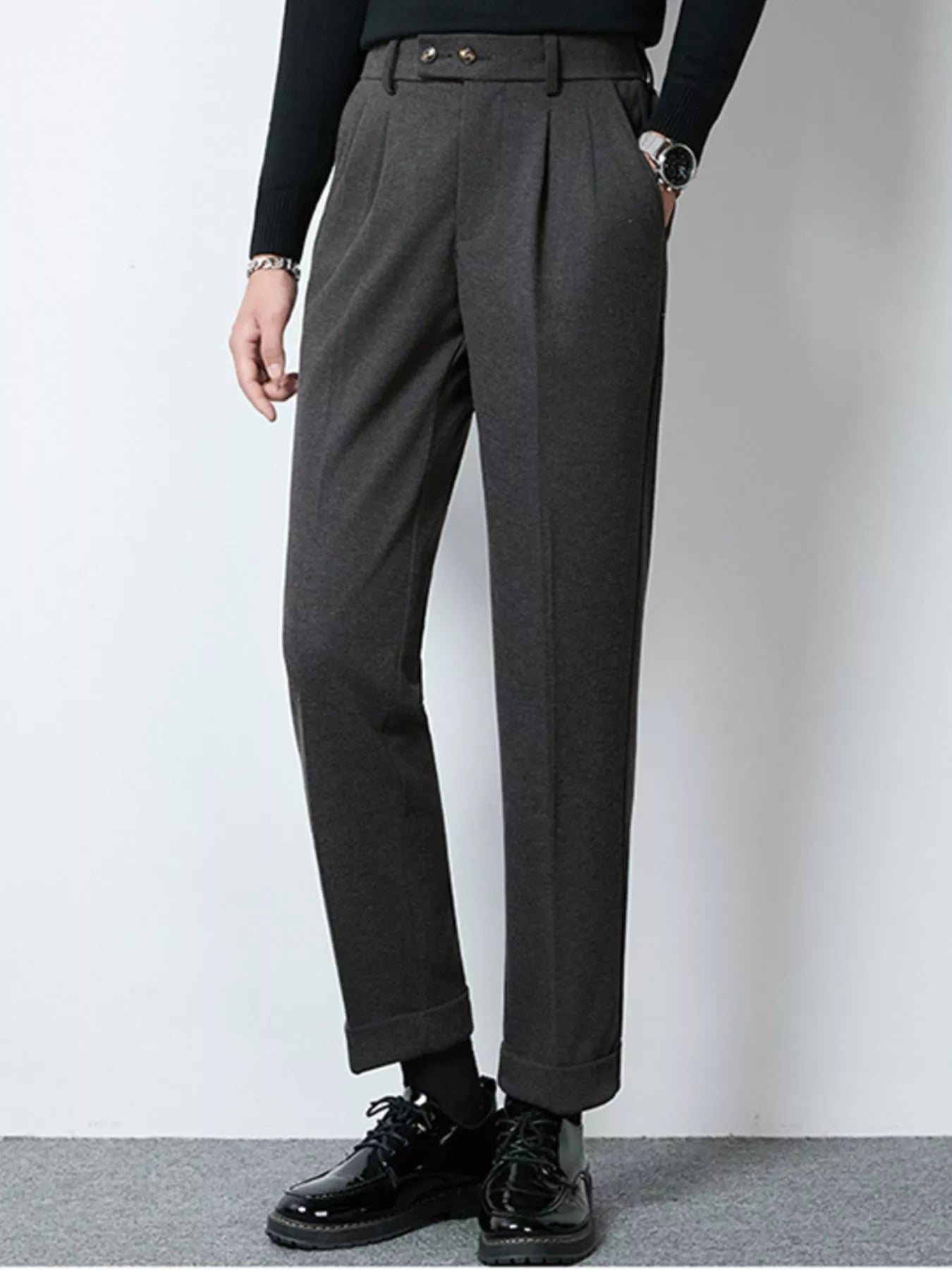 Dark gray men's pleated dress pants by Trendsi, tailored fit with classic pleats, suitable for formal or professional attire.