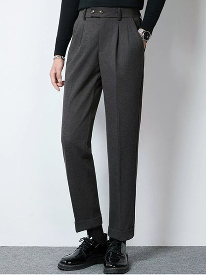Dark gray men's pleated dress pants by Trendsi, tailored fit with classic pleats, suitable for formal or professional attire.