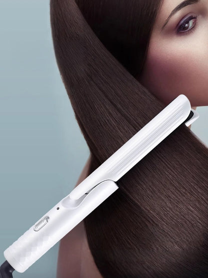 Dark gray Trendsi fast heating curling iron with European plug, showing the heated barrel and ergonomic handle.