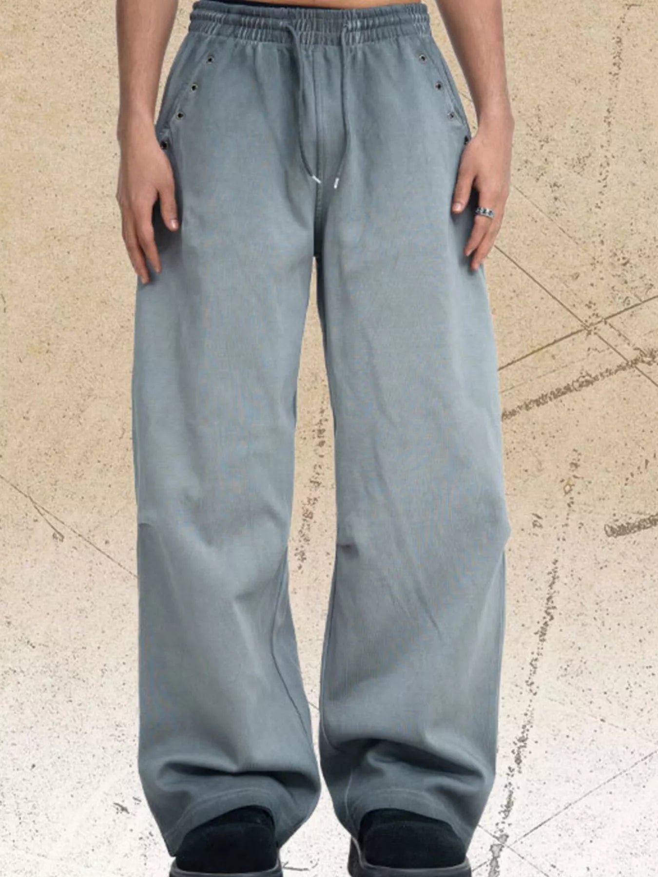 Dark gray men's drawstring wide-leg pants from Trendsi, featuring a relaxed fit and comfortable waistband.