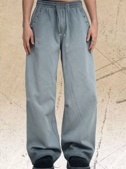 Dark gray men's drawstring wide-leg pants from Trendsi, featuring a relaxed fit and comfortable waistband.