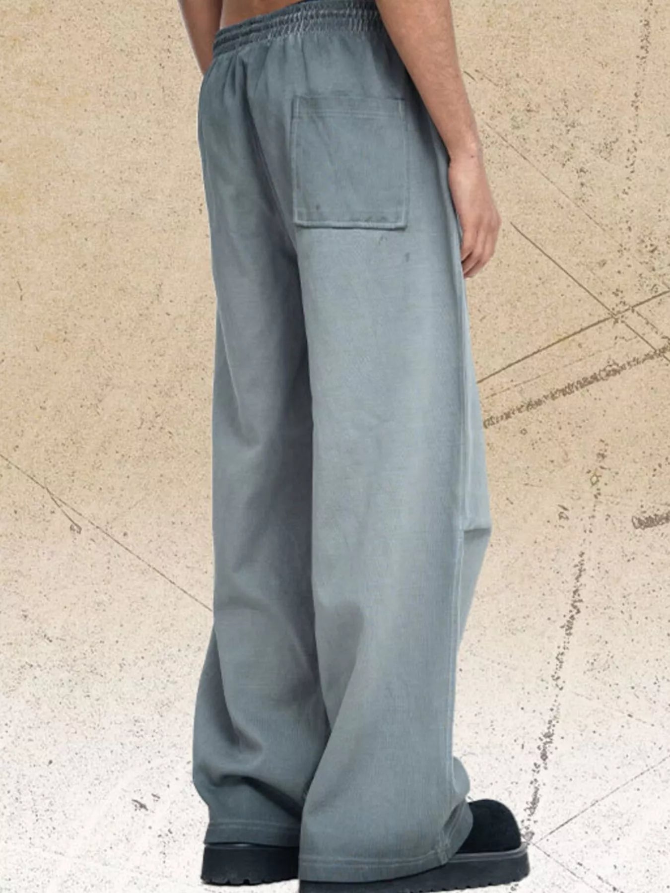 Dark gray men's drawstring wide leg pants by Trendsi, showing relaxed fit with adjustable waistband and casual style.