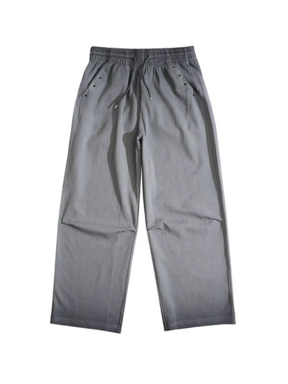 Men's dark gray drawstring wide-leg pants by Trendsi, featuring a relaxed fit and casual style, shown on a model.