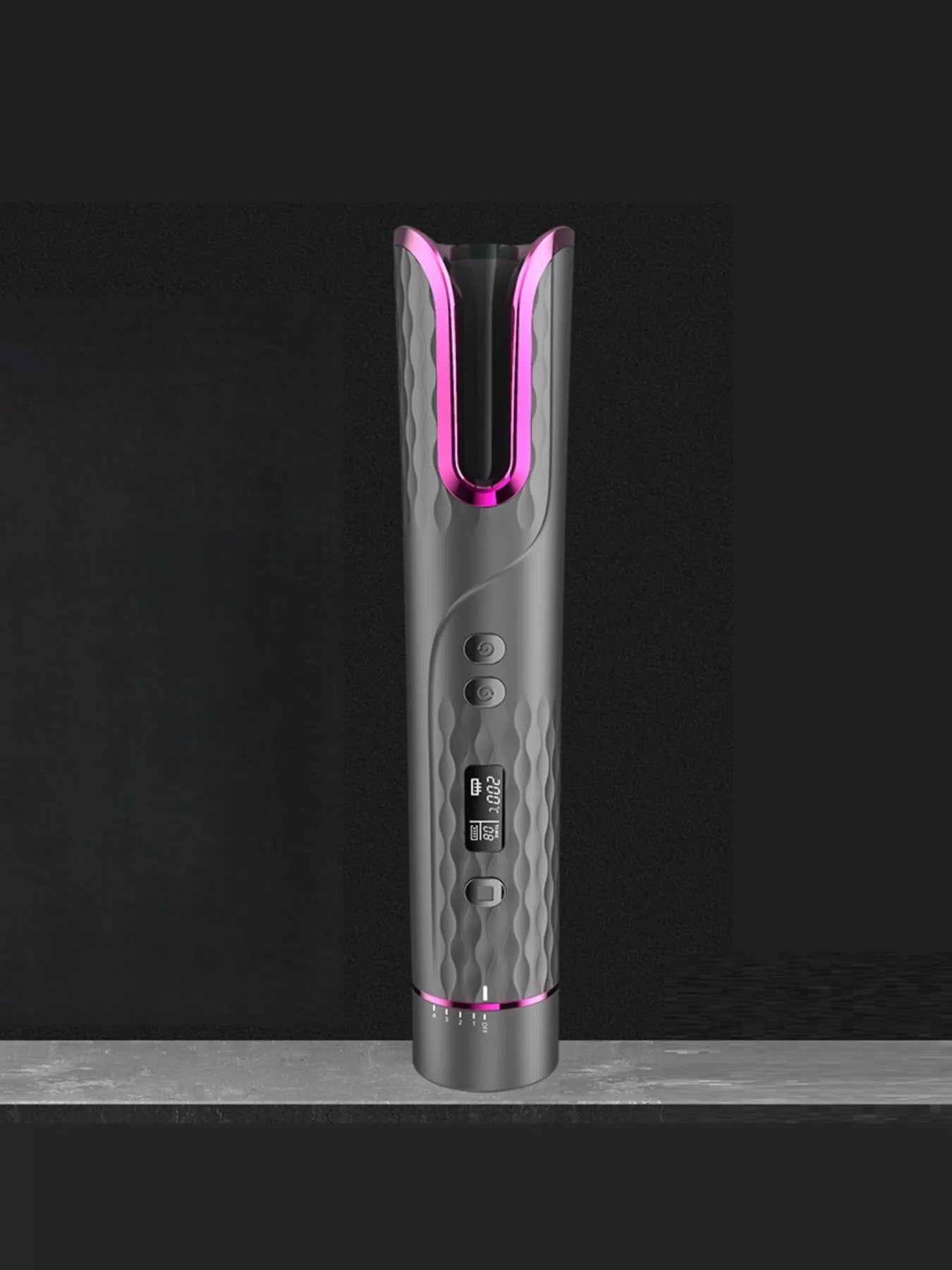 Dark gray automatic rotating ceramic hair curling iron by Trendsi, showcasing its sleek design and rotating barrel for effortless curls.