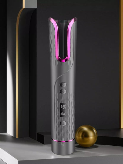 Dark gray automatic rotating ceramic hair curling iron by Trendsi, showcasing its sleek design and rotating barrel for easy styling.