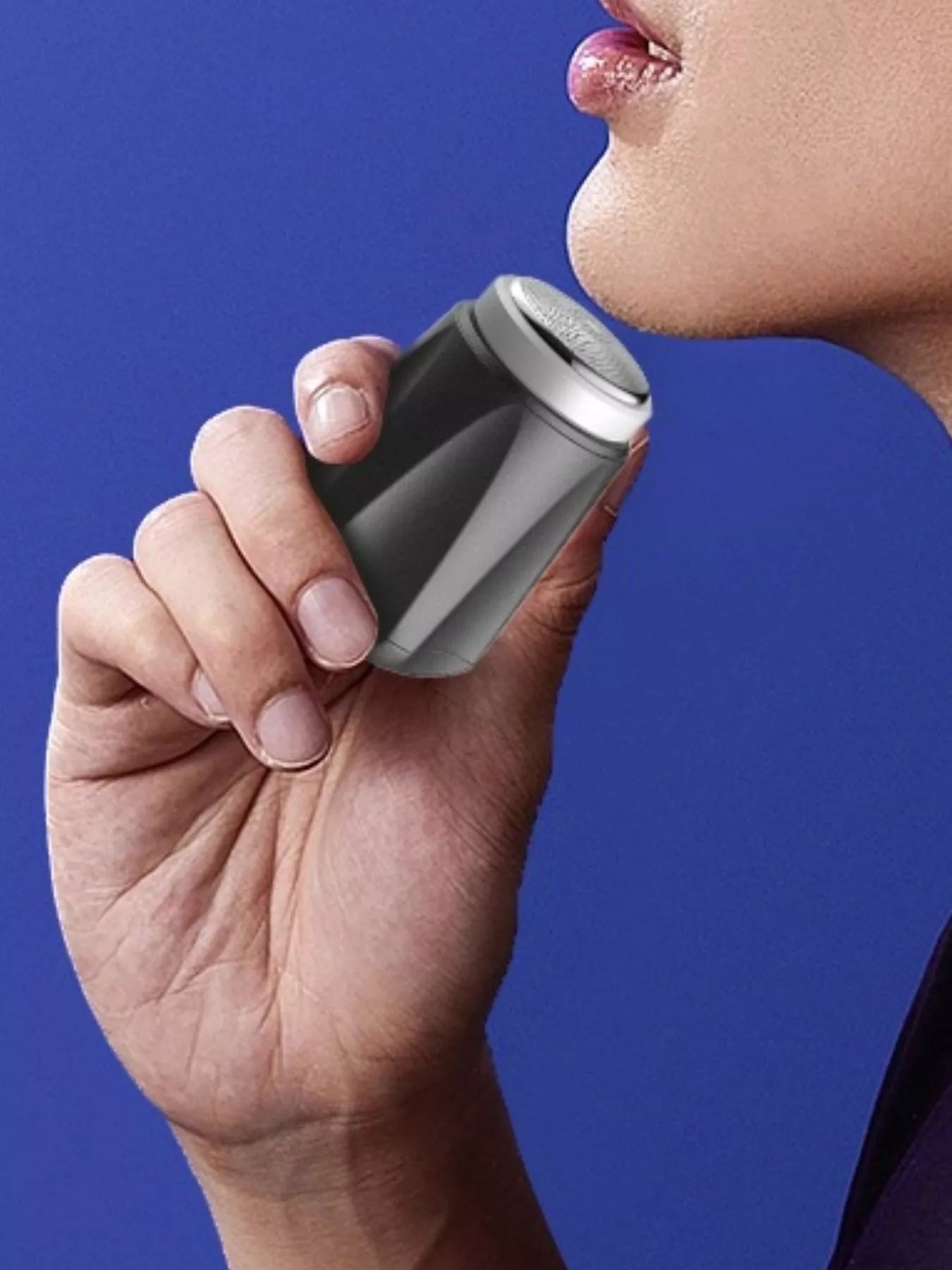Dark gray portable mini electric shaver by Trendsi, compact design ideal for travel and quick grooming.