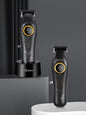 Dark gray cordless hair clipper with LED display, Trendsi brand, showcasing adjustable blades and ergonomic design.