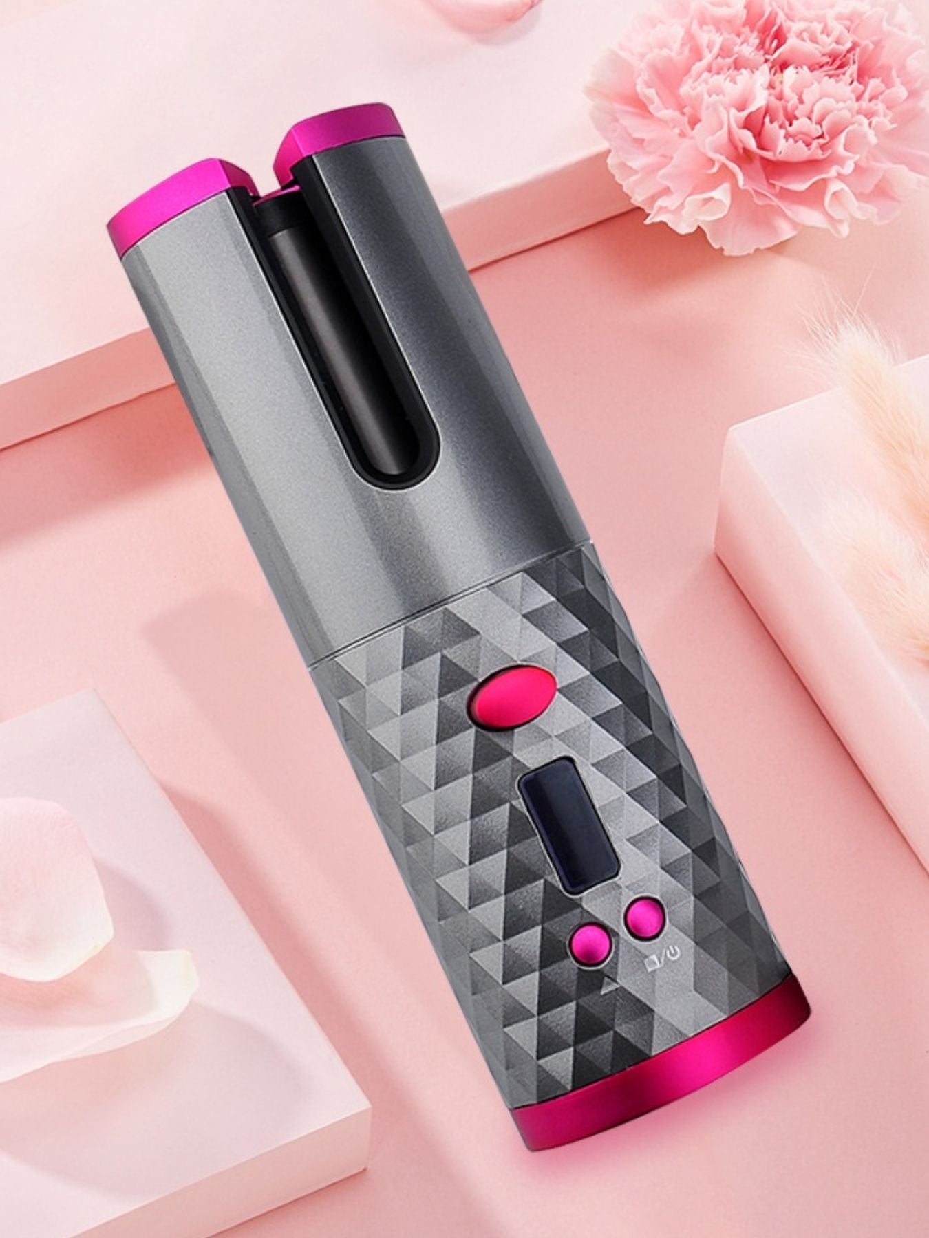 Dark gray portable automatic hair curler by Trendsi, compact design with a handle, ready to create curls effortlessly.