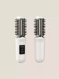 Dark gray portable hot air brush by Trendsi, compact styling tool with a handle and air vents for easy hair drying and styling.
