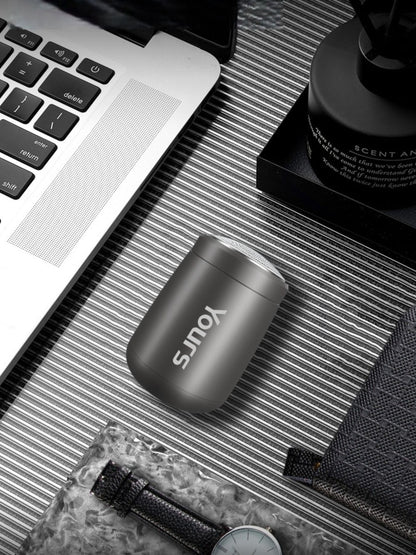 Dark gray portable mini electric shaver by Trendsi, compact design ideal for travel and quick grooming.