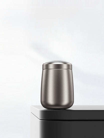 Dark gray portable mini electric shaver by Trendsi with compact design, suitable for travel and quick grooming.
