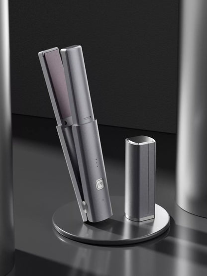 Dark gray portable rechargeable hair straightener from Trendsi, compact and easy to use for quick styling on the go.