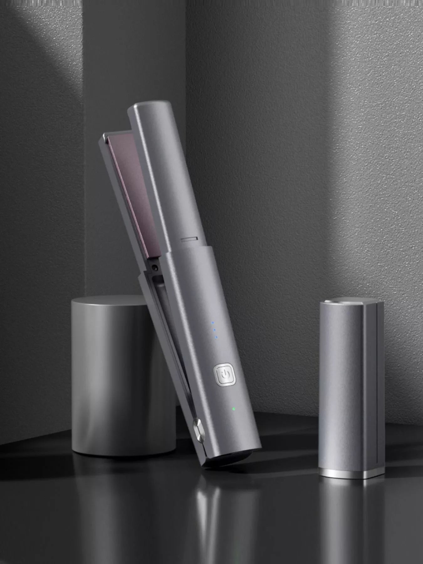Dark gray portable rechargeable hair straightener by Trendsi, compact and convenient for on-the-go styling.