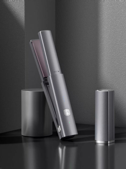 Dark gray portable rechargeable hair straightener by Trendsi, compact and convenient for on-the-go styling.
