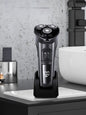 Dark gray rechargeable rotary electric shaver from Trendsi with LED display and ergonomic design for smooth grooming.