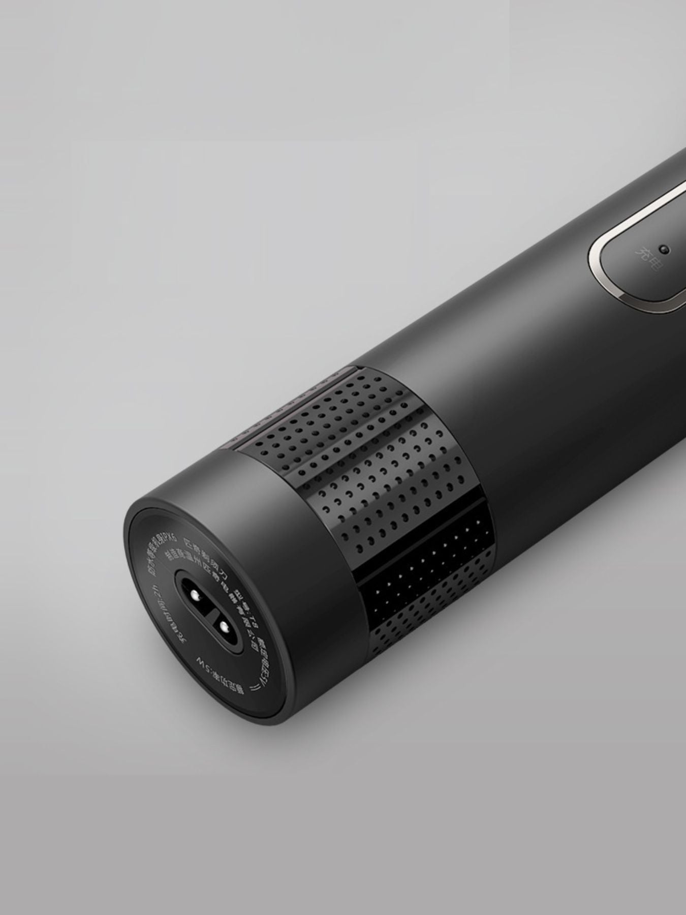 Dark gray rechargeable rotary shaver by Trendsi with a sleek, compact design and multiple rotary blades for close grooming.