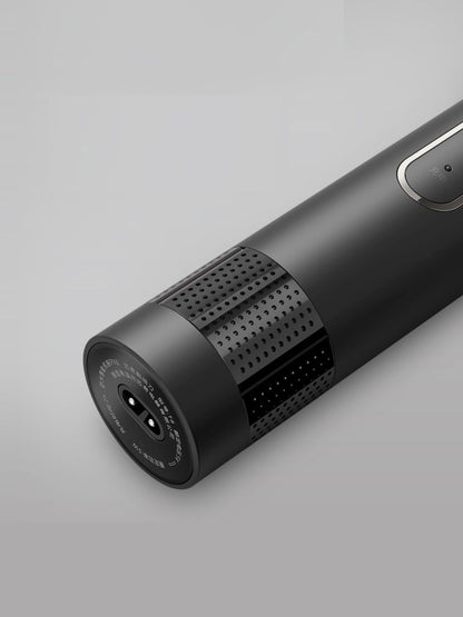 Dark gray rechargeable rotary shaver by Trendsi with a sleek, compact design and multiple rotary blades for close grooming.