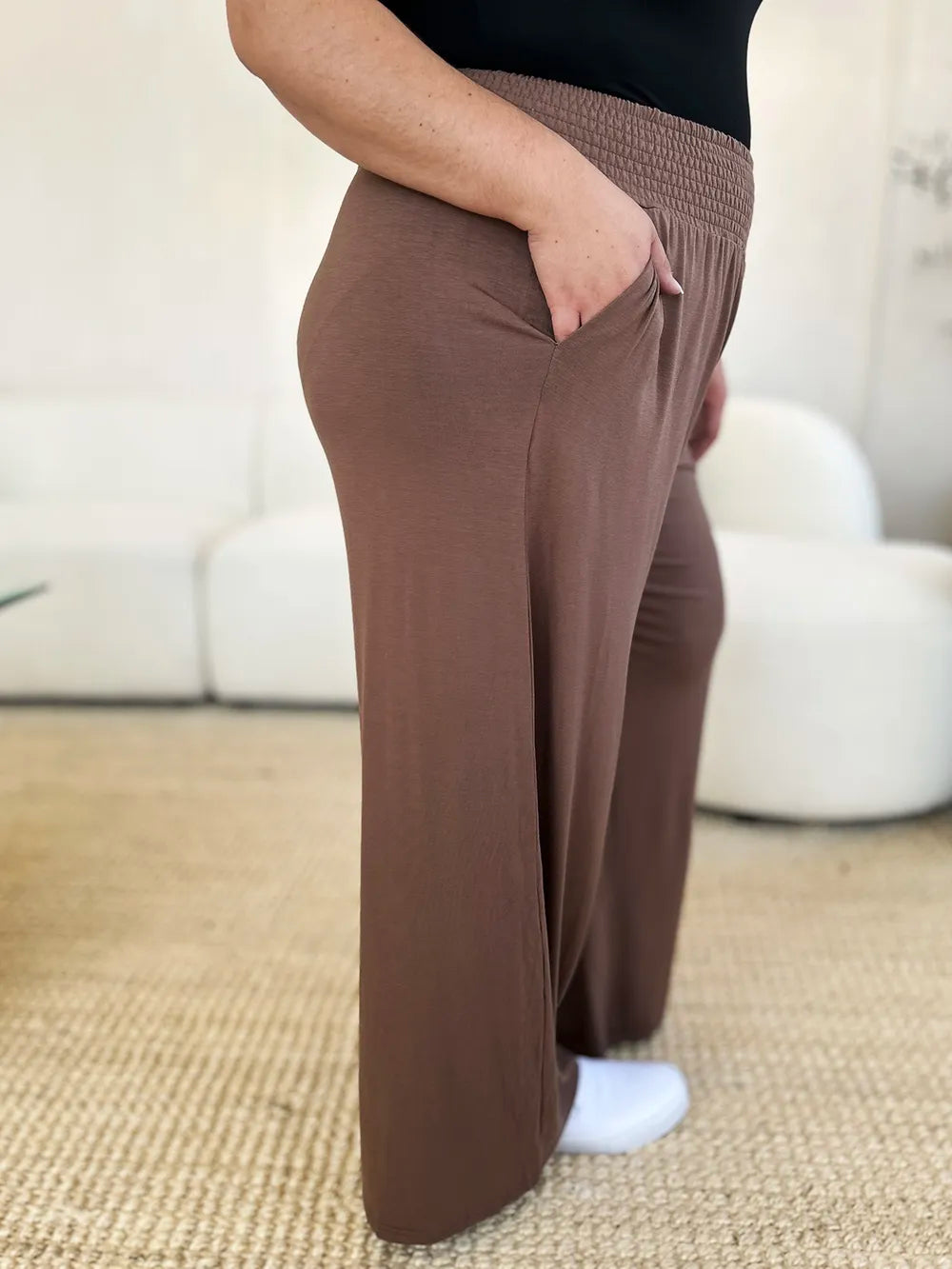 Dark gray Trendsi Basic Bae full-size smocked wide waistband wide-leg pants laid flat on a white background.