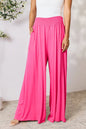 Dark gray Basic Bae full-size smocked wide waistband wide leg pants by Trendsi, featuring a relaxed fit and comfortable design.