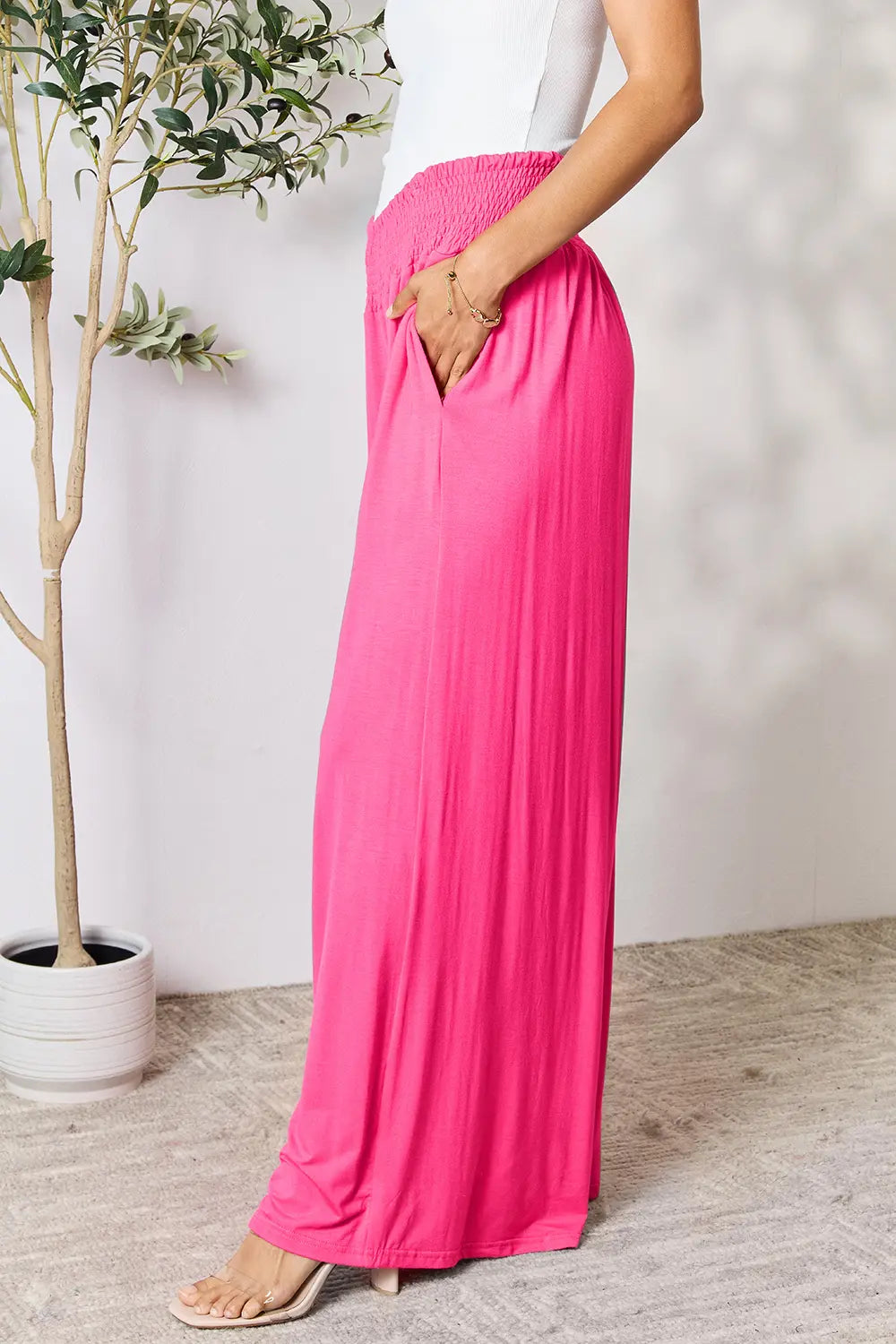 Dark gray Trendsi Basic Bae full-size smocked wide waistband wide-leg pants displayed on a model.