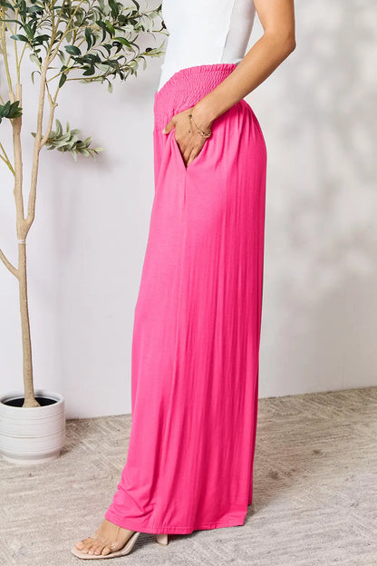 Dark gray Trendsi Basic Bae full-size smocked wide waistband wide-leg pants displayed on a model.