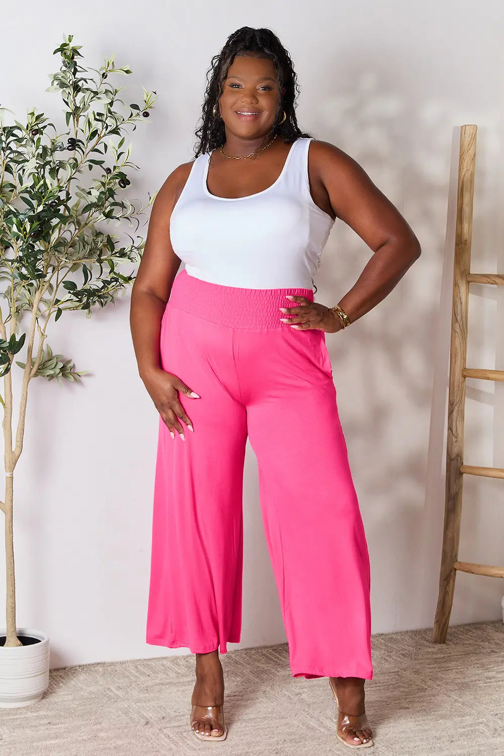 Dark gray Basic Bae full-size smocked wide waistband wide-leg pants by Trendsi, featuring relaxed fit and comfortable design.