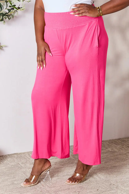 Dark gray Trendsi Basic Bae full-size smocked wide waistband wide-leg pants laid flat showing relaxed fit and soft fabric.